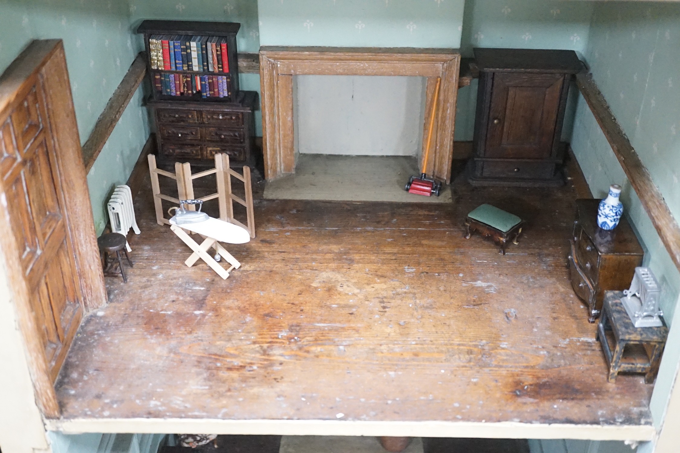An early 19th century painted doll's house with block work facade enclosing a four room interior with central staircase, to be sold with assorted later furniture and accessories, width 117cm, depth 48cm, height with asso